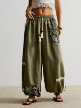 Olive green lace detail drawstring harem pants with wide-leg fit floral lace trim and side pockets
