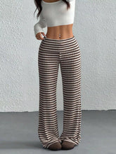 Brown and cream striped wide leg pants made of lightweight fabric ideal for casual and office wear