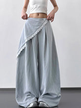 Light gray wide leg pants with delicate white lace trim along the side seam and a single button closure