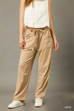 Beige umgee cargo-inspired drawstring pants with front pockets and relaxed fit ideal for casual wear