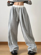 Gray heathered drawstring wide leg pants with white waistband and side seam stitching in soft fabric