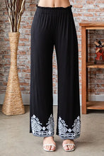 Heimish full size solid damask casual pants in black with wide-leg fit and white embroidered hem detail