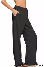 Black zenana fleece sweatpants with wide-leg relaxed fit and side pockets designed for comfort and easy care instructions