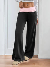 Black wide-leg pants with a pink contrast waistband wide leg design offering comfort and style