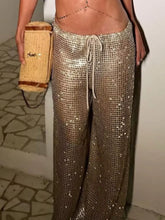 Shiny gold sequined drawstring wide leg pants with a comfortable drawstring waistband for stylish wear