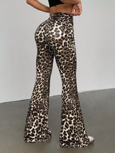 Leopard print high waist flare pants in stretchy form-fitting fabric with bold black and tan spots