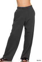 Black zenana fleece sweatpant with pockets features wide-leg design elastic waistband and relaxed flowing silhouette