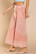 Pink pol elastic waistband wide leg pants with patchwork design and subtle stitching details with drawstring