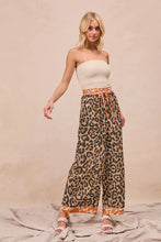 Bibi leopard print wide-leg pants with orange and beige contrast banding at waistband and hem