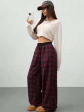Plaid wide leg pants in burgundy and black check with an elastic drawstring waistband for comfortable wear