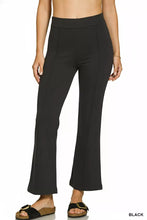 Black heavy ponte pintuck pants with elastic waistband featuring a smooth stretchy fabric and subtle side seam detailing