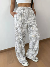 Silver and white abstract print wide leg pants with leaf pattern made of soft flowing fabric machine wash cold