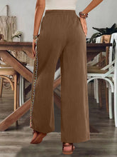 Bohemian wide leg brown pants with ribbed texture and embroidered decorative patterned side panels care instructions included