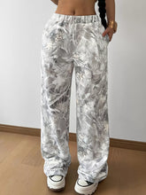Abstract print wide leg pants in silver and white leaf pattern made of soft flowing fabric machine wash cold safe