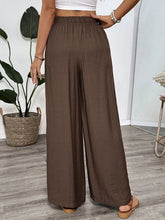 Brown casual wide-leg pants with soft textured fabric and elastic waistband suitable for easy care instructions
