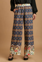 Blue umgee plus size wide-leg pants with elastic waistband and mixed print featuring floral hem and geometric design