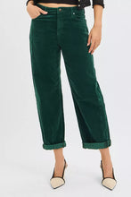 Deep green velvet corduroy crop barrel pants with relaxed wide-leg cut and rolled cuffs offer stylish comfort