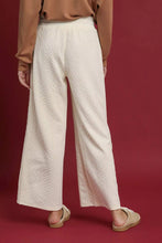 Cream-colored umgee cable knit textured wide leg pants with a woven pattern for stylish comfort and casual wear