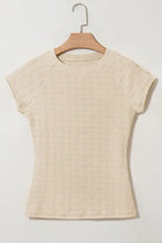 Cream-colored linen textured crew neck cap sleeve slim top for women