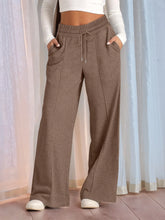 Brown wide-leg sweatpants in soft textured fabric with elastic waistband and drawstring relaxed fit plus size pants