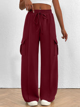 Maroon casual high waist cargo pants with drawstring waist and side pockets ideal for everyday wear