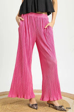 Bright pink umgee wide leg textured pants featuring pleated design and comfortable elastic waistband