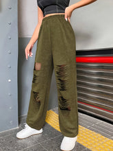 Olive green suede distressed elastic waist straight leg cargo pants with layered tear details on thighs