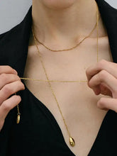 18k gold-plated chain pendant necklace with teardrop, cowrie, and coffee bean charms