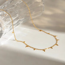 18K gold-plated cross necklace with delicate chain and small charms