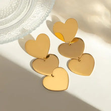 Two pairs of 18k gold-plated heart earrings