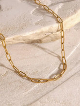 18k gold-plated layered necklace with starburst pendant and stainless steel extension chain