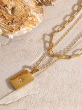 18k gold-plated layered necklace with starburst rhinestone pendant and stainless steel extension chain