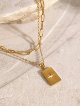 18k gold-plated layered necklace with starburst pendant and stainless steel extension chain