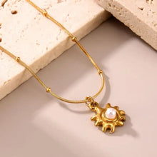 18k gold-plated shell pearl necklace with sunburst pendant