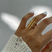 18k gold-plated stainless steel asymmetrical double bar ring on manicured nails