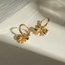 18k gold-plated stainless steel bow earrings with delicate gold bow hoops