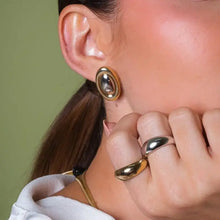 18K gold-plated stainless steel stud earring on woman’s ear and rings