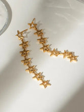 18k gold-plated steel cutout star drop earrings with cascading design