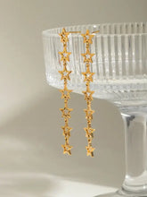 18k gold-plated steel cutout star drop earrings with dangle design