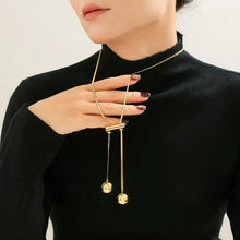 Elegant 18k gold-plated titanium steel hollow bead lariat necklace on woman