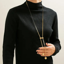 Woman in 18k gold-plated titanium steel hollow bead lariat necklace