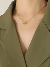 18k gold-plated titanium steel hoop pendant necklace on green blazer