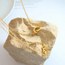 18k gold-plated titanium steel knot necklace set with two gold-toned chains
