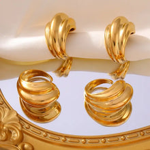 Four 18K gold-plated titanium steel open rings shaped like golden croissants with reflections