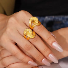 Two 18K gold-plated twisted rings on fingers