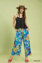 Umgee floral print wide leg pants in vibrant blue yellow and orange hues with frayed hem and floral pattern