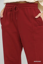 Umgee fleece jogger pants in burgundy with drawstring waist allows adjustable fit and side pockets for convenience