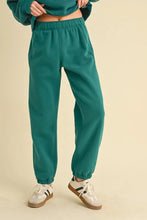 Teal soft cotton Aemi Co drawstring elastic waist joggers with elastic waistband and cuffed ankles