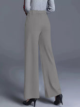 Beige high-waisted wide leg pants with smooth tailored fabric and straight-cut silhouette machine wash tumble dry care instructions