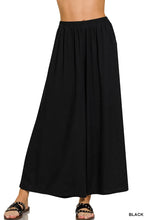 Black flowing maxi skirt with elastic waistband in zenana woven pleated linen blend for comfortable wear